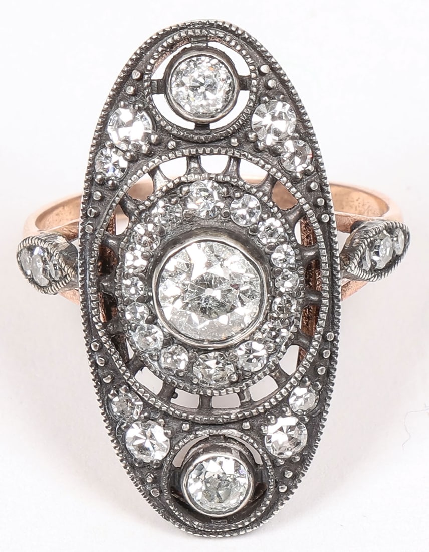 RUSSIAN GOLD & DIAMOND RING, LORIE: RUSSIAN GOLD & DIAMOND RING, LORIE. Comprising an oval setting centered with a bright, approximate ? carat, cut diamond within an openwork bezel surrounded by accent diamonds and overall encrusted wit