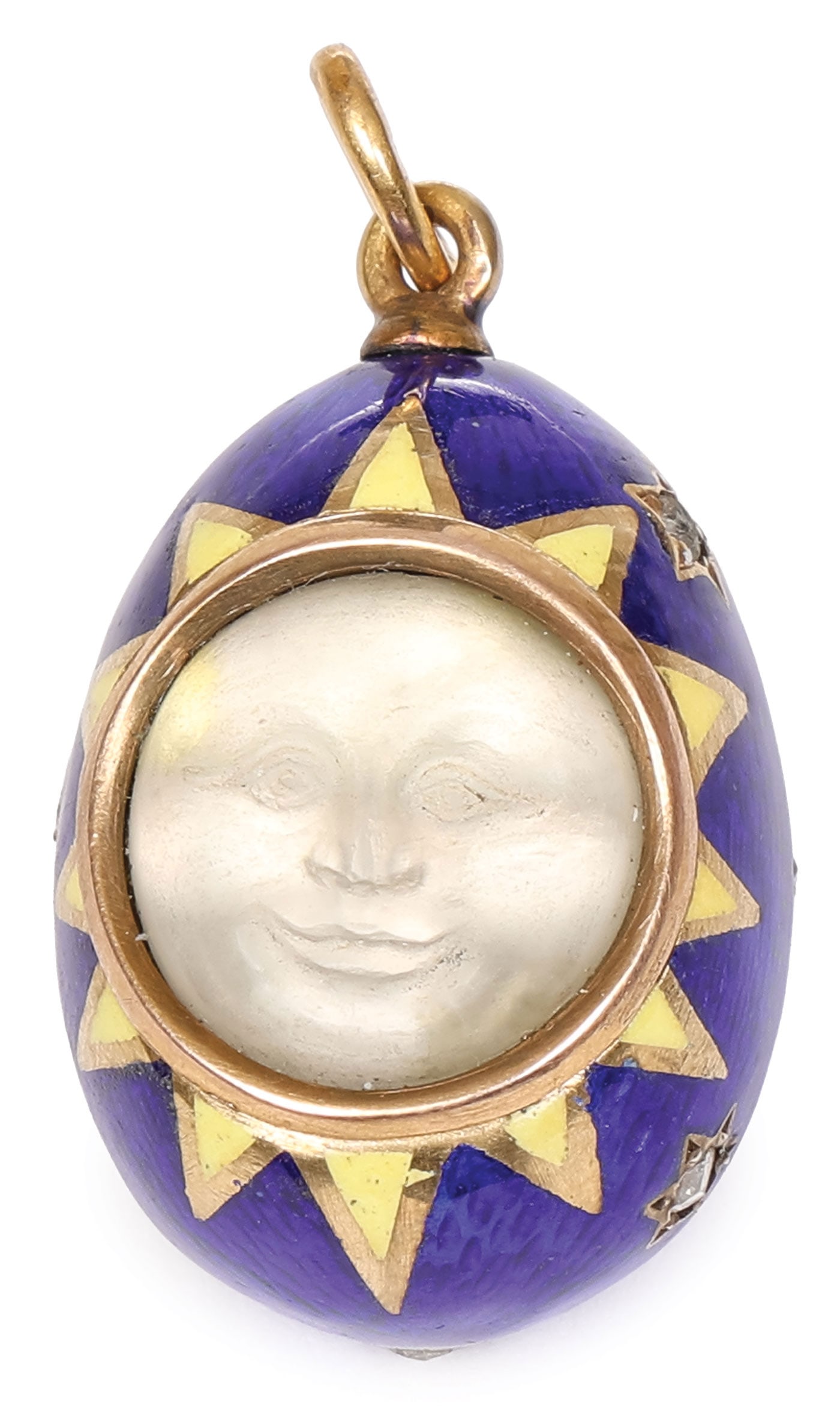 FINE FABERGE GOLD, ENAMEL & GEMSTONE PENDANT EGG: FINE FABERGE GOLD, ENAMEL & GEMSTONE PENDANT EGG. The body overall in translucent dark blue enamel over an etched guilloche ground and with ten evenly spaced gold framed stars, each set with a rose cu