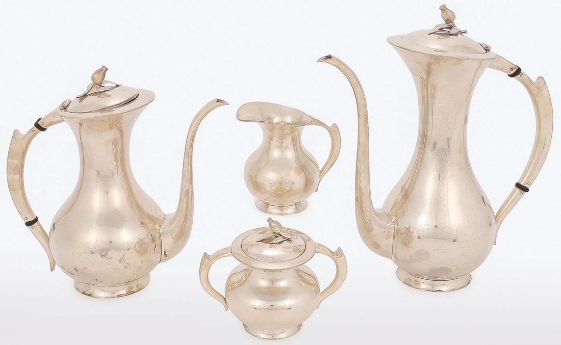 STERLING 4-PIECE MODERNIST TEA SERVICE: STERLING 4-PIECE MODERNIST TEA SERVICE. Comprising a coffee pot, teapot, covered sugar, and creamer. The lids with rosebud finials. The undersides of each stamped STERLING and .950. Possibly Emil Herm