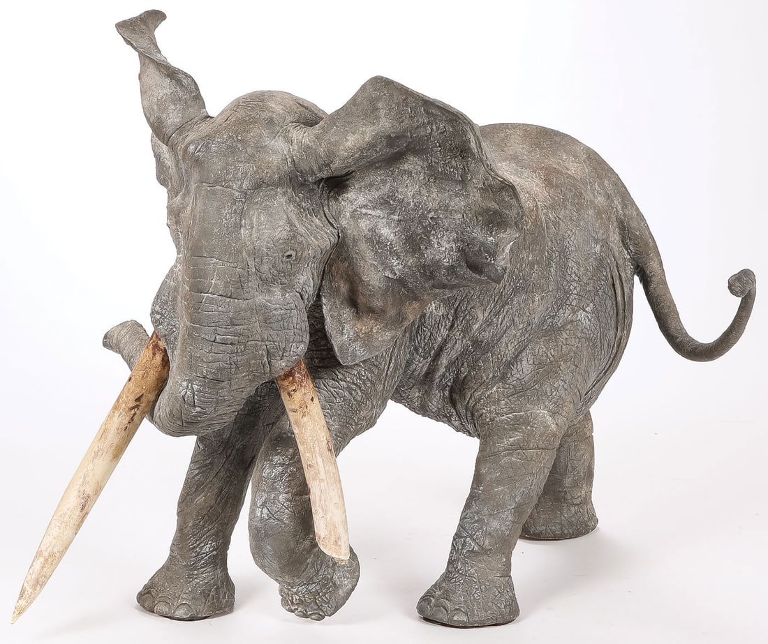GREAT FRANCOIS VANDENBERGHE BRONZE: Francois Vandenberghe (French b. 1951 -) Bado Mekambo Bronze with African earth patina and composite tusks Signed on rear leg Height 18 inches (46cm), overall length 22.5 inches (56.5cm) SHIPPING