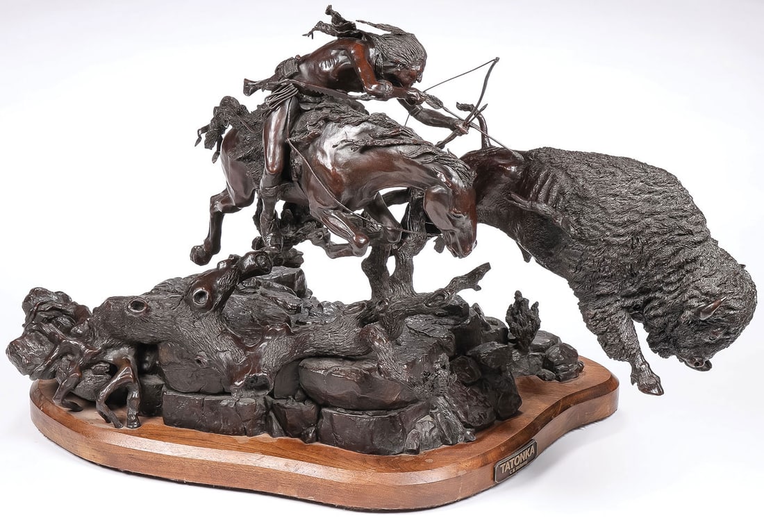 GREAT LARGE NATIVE AMERICAN BRONZE GROUP: Buck Mahaney (American 1941-2020) Tatonka -1992 Bronze with dark brown patina on rotating walnut base Signed on back base, dated 92, and editioned 25/28, with title plaque Overall height on stand 24