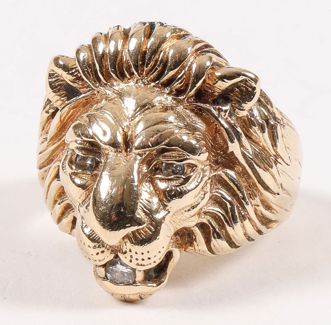 MEN'S GOLD & DIAMOND RING: MEN'S GOLD & DIAMOND RING. Comprising a men's 14K gold and diamond lion's head ring. The lion head finely sculpted and the eyes and mouth set with cut diamonds. Faintly marked, tests 14KT. Approximate