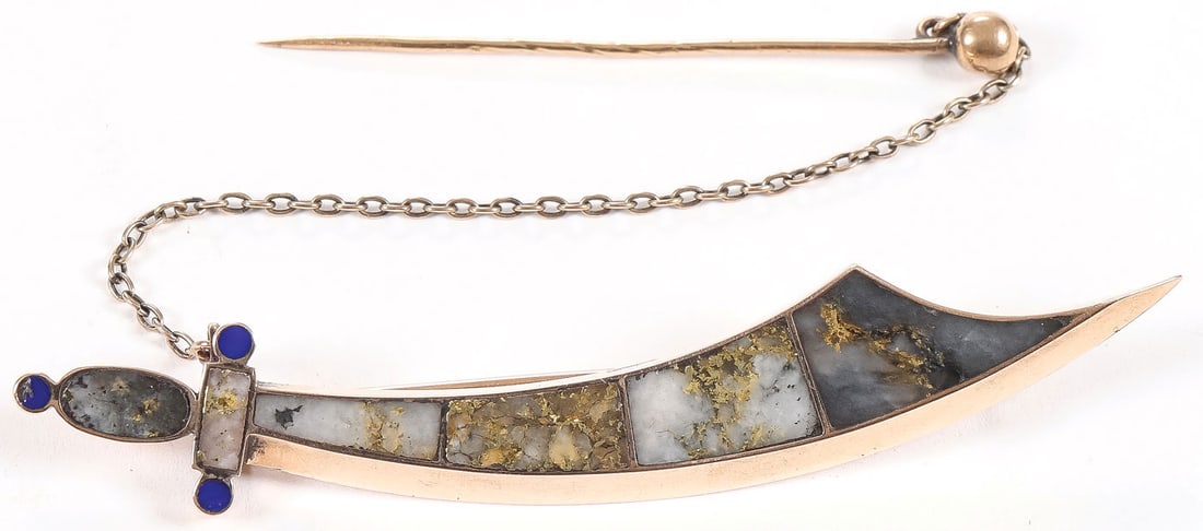 CALIFORNIA GOLD RUSH JEWELRY & MORE: CALIFORNIA GOLD RUSH JEWELRY & MORE. Comprising a finely crafted gold, quartz and lapis sword-shaped brooch. The gold-framed blade comprised of four pieces of shaped quartz gold, the handle similarly 