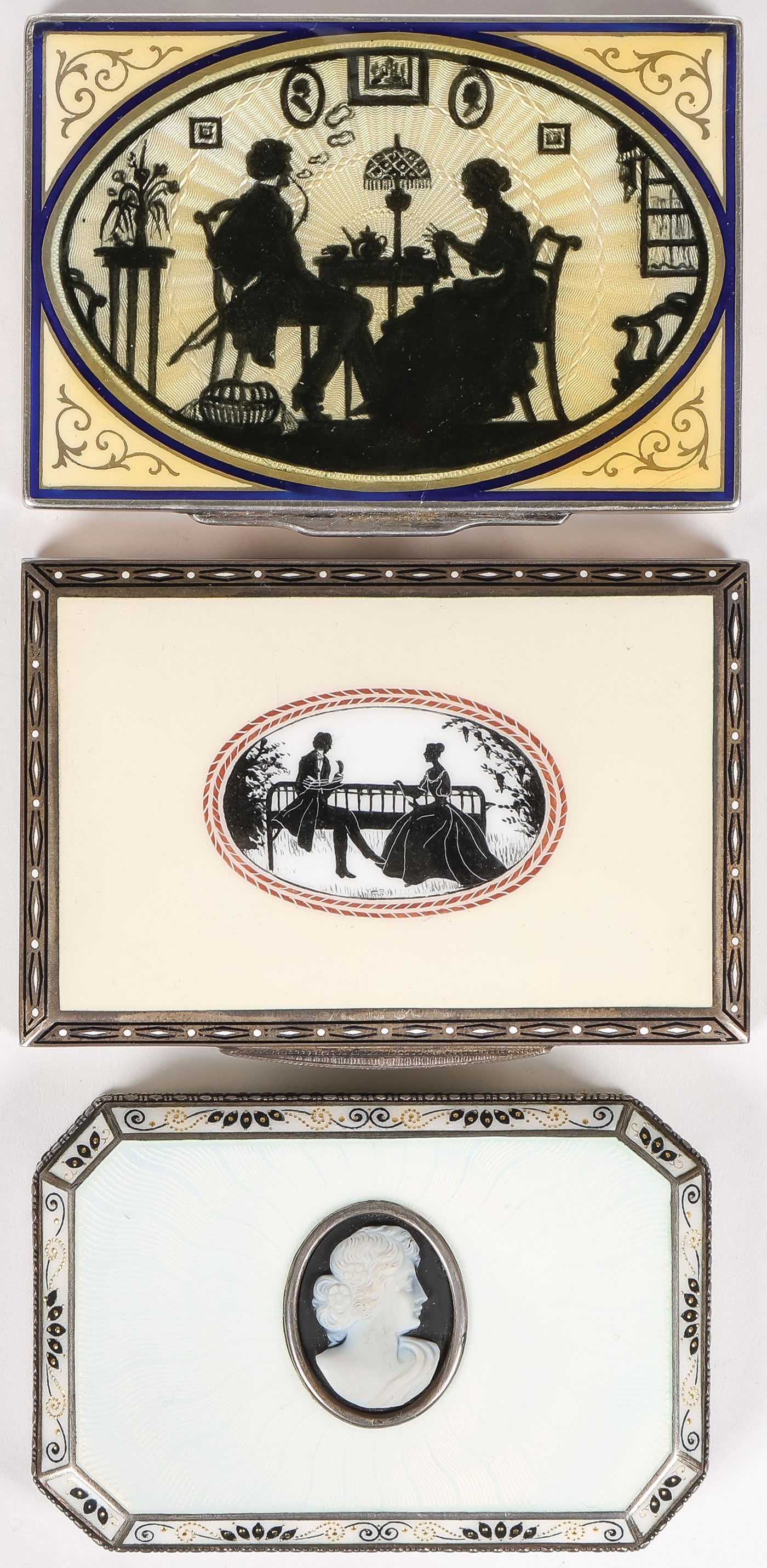 THREE AUSTRIAN SILVER & ENAMEL CASES: THREE AUSTRIAN SILVER & ENAMEL CASES. Comprising three Austrian silver-gilt and enamel cases, including two rectangular examples: the larger of the two with a hinged lid decorated with an oval silhoue