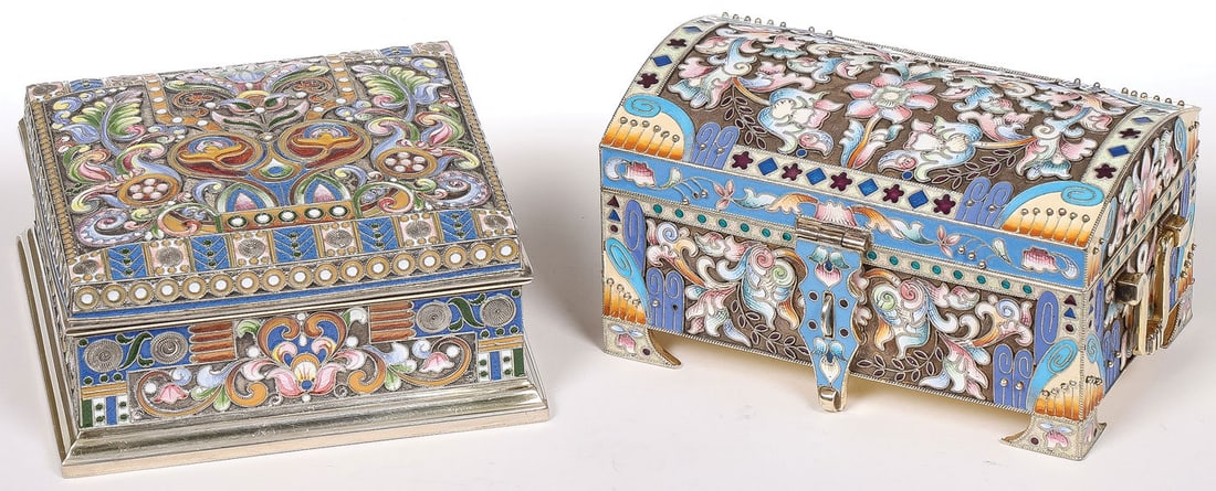 PAIR OF RUSSIAN SILVER & ENAMEL BOXES: PAIR OF RUSSIAN SILVER & ENAMEL BOXES. Comprising a casket-shaped box on bracket feet, with domed hinged cover and gilded swivel handles. The underside bearing Moscow hallmark, the date 1891, and pseu