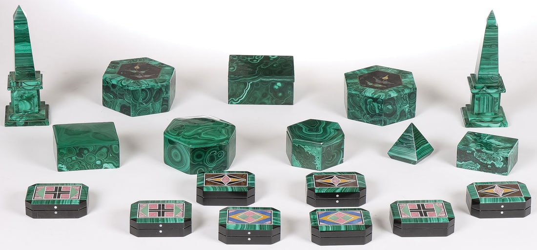 18 MALACHITE BOXES & OBELISKS: 18 MALACHITE BOXES & OBELISKS. Comprising fifteen malachite boxes of various shapes, sizes, and forms, each with fitted lid, some with inlays as shown, as well as a pair of malachite obelisks and a