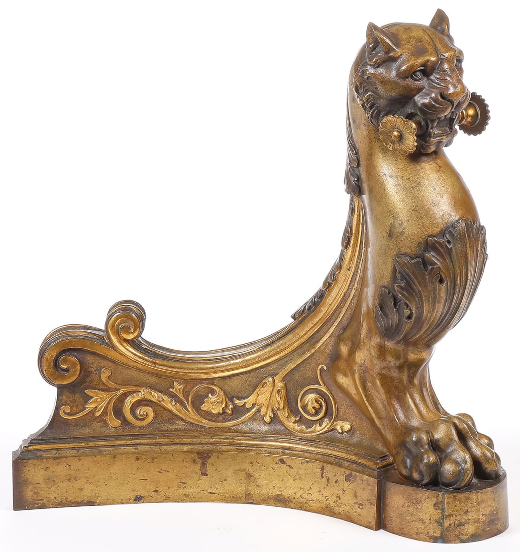 EXCEPTIONAL GILT BRONZE ANDIRON: EXCEPTIONAL GILT BRONZE ANDIRON. Comprising a finely sculpted Neoclassical gilt bronze andiron stand, depicting an arched lion with masculine claw and paw feet and acanthus chest and swooped scroll
