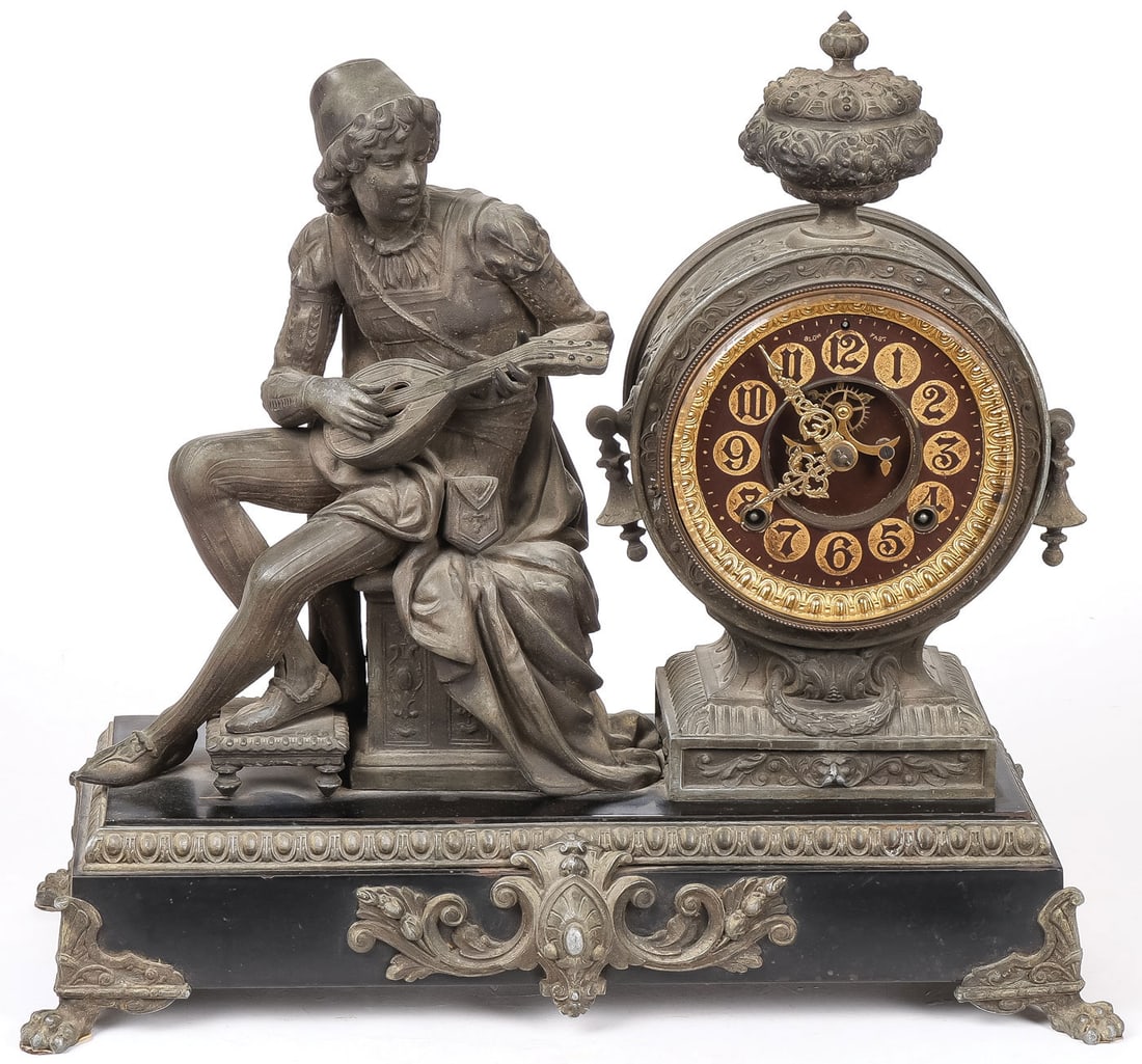 LARGE FIGURAL MANTLE CLOCK, C. 1882: LARGE FIGURAL MANTLE CLOCK, C. 1882. Comprising an impressive Ansonia figural mantel clock. Resting on four paw feet at each corner, supporting a rectangular black painted iron base with gadroon bandi