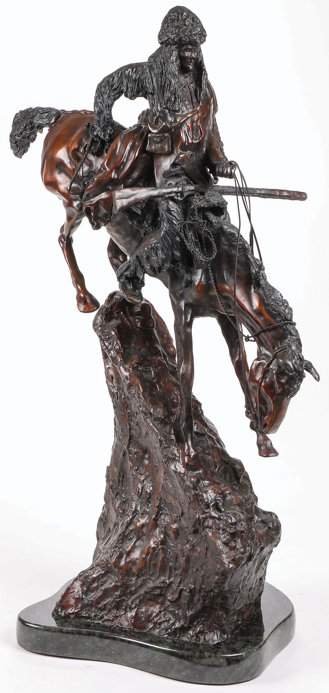 GOOD REMINGTON MOUNTAIN MAN BRONZE: GOOD REMINGTON MOUNTAIN MAN BRONZE. Comprising a high quality patinated bronze figure of Frederick Remington's famous "Mountain Man" sculpture resting on a polished granite base. Signed Frederick