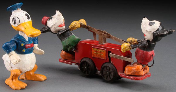 A LIONEL MICKEY MOUSE HAND CAR, NUMBER 1100 TOY: A LIONEL MICKEY MOUSE HAND CAR, NUMBER 1100, CIRCA 1930S. With composition bodies. Together with a Donald Duck hand car figure. Largest length 8 inches (20 cm).