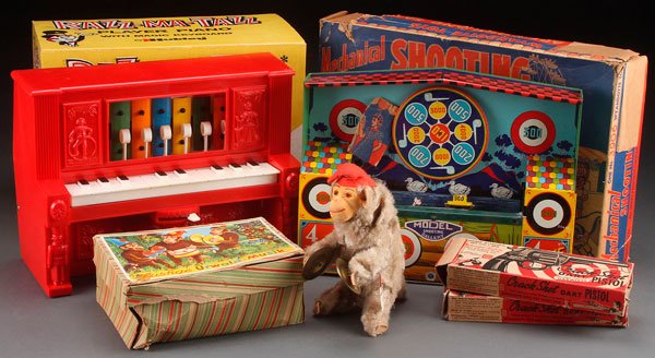 A WYANDOTTE MECHANICAL SHOOTING GALLERY TOY: A WYANDOTTE MECHANICAL SHOOTING GALLERY, MID 20TH CENTURY. Tin litho wind up, in original box, with two boxed dart pistols. Together with a Hubley Razz-Ma-Tazz player piano in box and a Lustige wind u