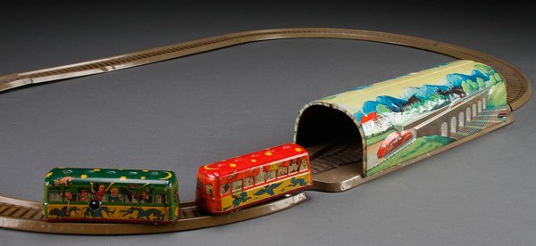A US ZONE GERMANY TECHNO FIX GHOST TRAIN TOY WIND UP: A US ZONE GERMANY TECHNO FIX GHOST TRAIN, MID 20TH CENTURY. Tin litho wind up with two cars. Length of largest section 14.5 inches (36.75 cm).