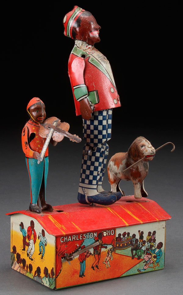 A BLACK AMERICANA "CHARLESTON TRIO" MARX WIND-UP TOY: A BLACK AMERICANA "CHARLESTON TRIO" MARX WIND-UP, CIRCA 1921. Tin litho. Height 9.5 inches (24 cm).