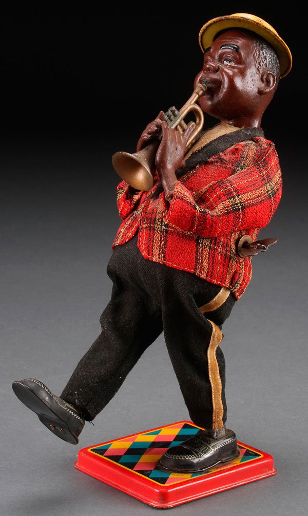 A LOUIS ARMSTRONG TIN LITHO WIND UP TOY JAPAN: A LOUIS ARMSTRONG TIN LITHO WIND UP TOY, JAPAN, MID 20TH CENTURY. Height 10 inches (26 cm).