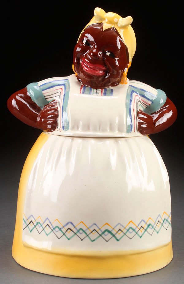 A BLACK AMERICANA BRAYTON LAGUNA "MAMMY" COOKIE JAR: A BLACK AMERICANA BRAYTON LAGUNA POTTERY "MAMMY" COOKIE JAR, MID 20TH CENTURY. Height 12.5 inches (32 cm).