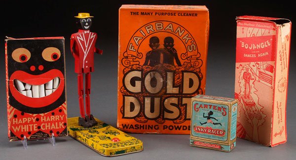 A FOUR PIECE BLACK AMERICANA ADVERTISING GROUP: A FOUR PIECE BLACK AMERICANA GROUP. Including a Happy Hairy white chalk box, Bo Jangle Dances Again toy in the original box, gold dust washing powder box and Carter's ink box. Largest height 8.75 inch