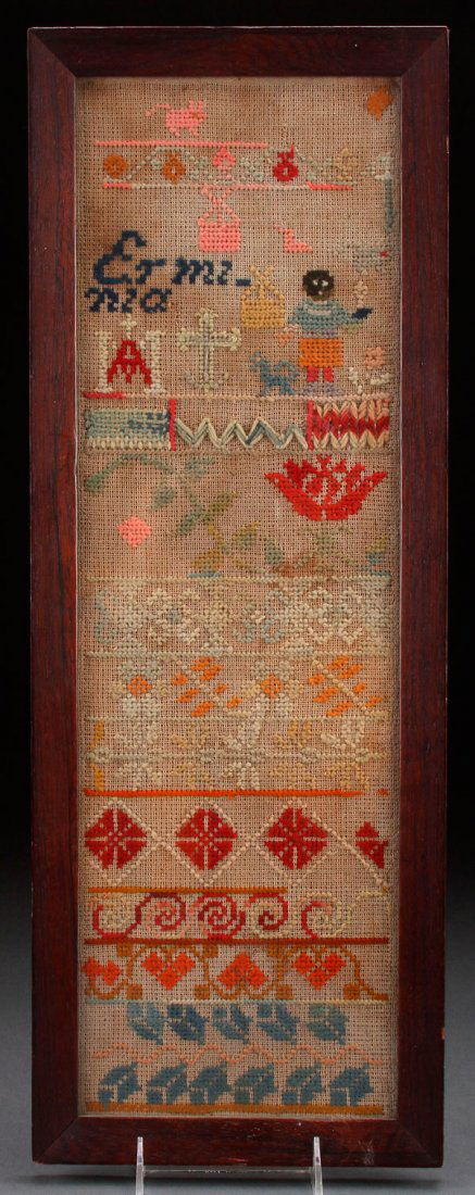 A BLACK AMERICANA YARN STITCHED SAMPLER: A BLACK AMERICANA YARN STITCHED SAMPLER, PROBABLY LATE 19TH CENTURY. Depicting a young black figure with animal forms and flower shapes, inscribed Erminia. Contained in a walnut frame. 23.5 inches x 8