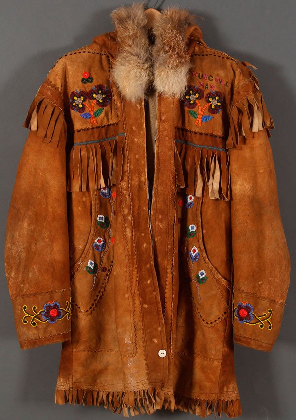 A BEADED HIDE PARKA, 20TH CENTURY: A BEADED HIDE PARKA, 20TH CENTURY. The front sides beaded, the shoulder area beaded, and beaded cuffs and fringe. Supple. Approximate size men's 36-38.