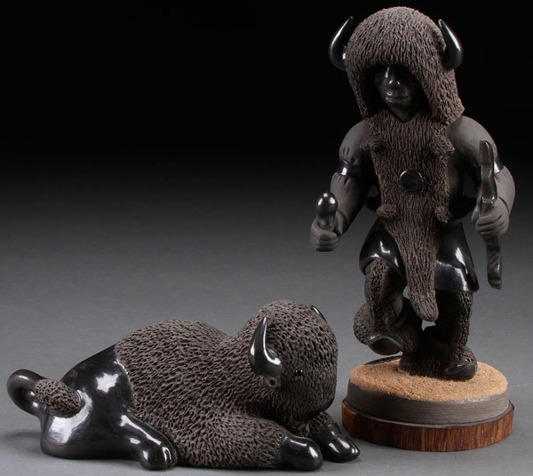 A PAIR OF NATIVE AMERICAN SANTA CLARA POTTERY FIGURES: A PAIR OF NATIVE AMERICAN SANTA CLARA POTTERY FIGURES. Including a dancer and a reclining buffalo, both signed Tony & Patty Padilla, Santa Clara and dated 1985. Greatest height 9.25 inches.