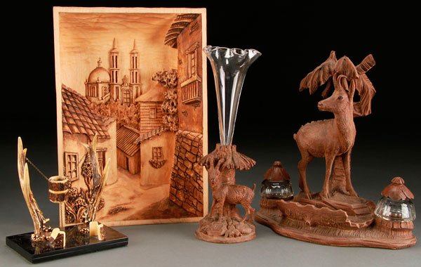 A RUSSIAN AND BLACK FOREST CARVED WOOD DECORATIVE: A RUSSIAN AND BLACK FOREST CARVED WOOD DECORATIVE GROUP, 20TH CENTURY. Comprising an antler desk stand, a carved Russian scenic wall plaque with cathedral in deep relief, a carved wood figural with ch