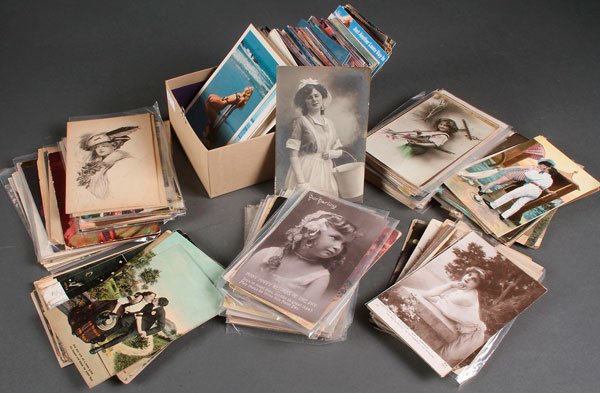 OVER 500 ROMANTIC, GLAMOUR, RISQUÉ & EROTIC POSTCARDS: OVER 500 ROMANTIC, GLAMOUR, RISQUÉ AND EROTIC POSTCARDS, EARLY TO LATE 20TH CENTURY. With a variety of scenes, subjects, topicals, some real photo, bathing beauties, and reproduction nude pin-ups. In