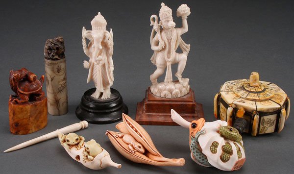 AN EIGHT PIECE ORIENTAL DECORATIVE ARTS GROUP: AN EIGHT PIECE ORIENTAL DECORATIVE ARTS GROUP, 20TH CENTURY. Comprising two ivory Indo-Persian deities, two Chinese carved soapstone chops, an Oriental carved bone lidded box and three contemporary Ja