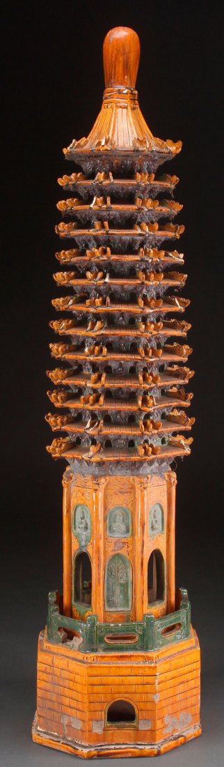 A LARGE CHINESE SANCAI GLAZED POTTERY STUPA: A LARGE CHINESE SANCAI GLAZED POTTERY STUPA. Of architectural form, some losses. Height 40.5 inches (103 cm).