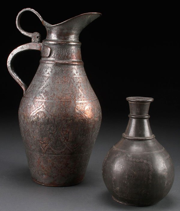 A LARGE PERSIAN TINNED COPPER PITCHER: A LARGE PERSIAN TINNED COPPER PITCHER, 19TH CENTURY. Elaborately decorated all over with floral designs and cartouches of Princely figures, the neck with an Arabic inscription, height 15.75 inches (40