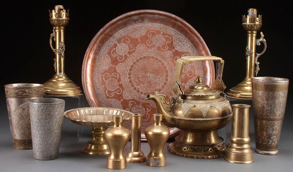 A TEN PIECE GROUP OF PERSIAN DECORATIVE BRASS: A TEN PIECE GROUP OF PERSIAN DECORATIVE BRASS AND COPPER, 19TH/20TH CENTURY. Comprising a handled tea kettle, footed compote, three beakers, four vases and a tray with diameter 15 inches (38 cm); toge