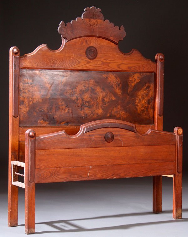 A COTTAGE OAK THREE QUARTER SIZE VICTORIAN BED.