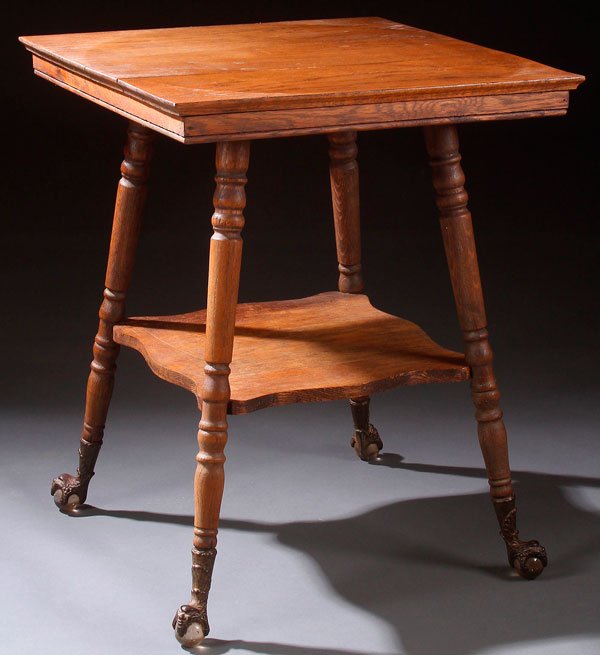 A VICTORIAN SQUARE OAK PARLOR TABLE.