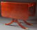 A DUNCAN PHYFE STYLE MAHOGANY DROP LEAF TABLE