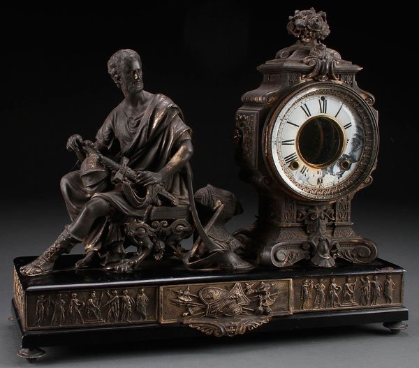 AN ANSONIA NEOCLASSIC FIGURAL MANTLE CLOCK,: AN ANSONIA NEOCLASSIC FIGURAL MANTLE CLOCK, 19TH CENTURY. Depicting a seated Greek warrior, damage/loss to chapter ring. Length 19 inches (48 cm).