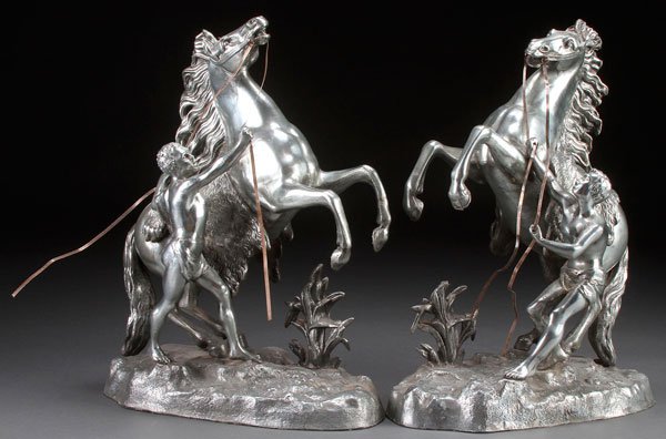 A PAIR OF ALUMINUM MARLEY HORSE SCULPTURES: A PAIR OF ALUMINUM MARLEY HORSE SCULPTURES, CIRCA 1925. Height 15.75 inches.