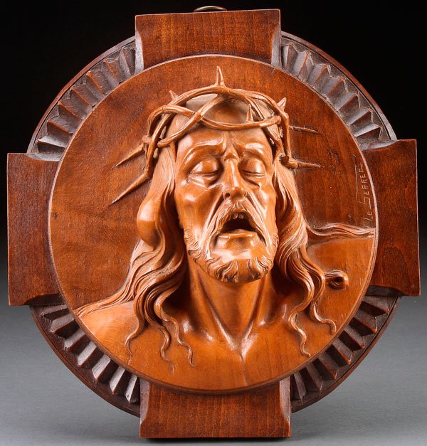 FINE FRENCH CARVED WOOD RELIGIOUS PLAQUE: A VERY FINE CARVED RELIEF PLAQUE OF THE CRUCIFIED CHRIST, FRENCH CIRCA 1915. Finely carved in half round with flowing hair, pierced crown of thorns, open mouth, with carved teeth and tongue and mounte