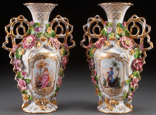TWO DRESDEN STYLE DECORATED PORCELAIN MANTLE VASES: A PAIR OF DRESDEN STYLE DECORATED PORCELAIN MANTLE VASES, LAST HALF 20TH CENTURY. With transfer decorated scenes, gilt scrolling and applied florals. Blue crossed sword marks. Height 13.5 inches (34 c