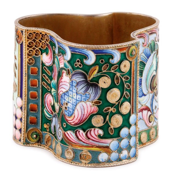 A RUSSIAN SILVER-GILT AND ENAMELED NAPKIN RING: A FINE RUSSIAN SILVER-GILT AND SHADED ENAMEL NAPKIN RING, 20TH ARTEL. The undulating cylindrical form overall in shaded enameled flowers and geometric shapes in the Pan Slavic style. Hallmarked Moscow