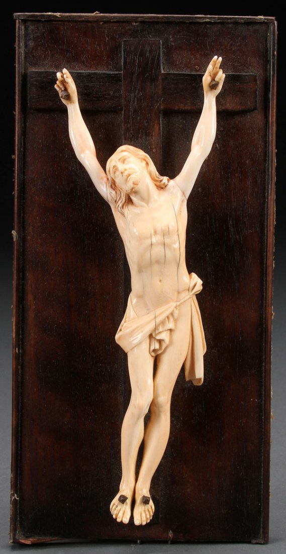 A FINELY CARVED IVORY CORPUS CHRISTI: A CARVED IVORY CORPUS CHRISTI, PROBABLY FLEMISH, 18TH OR 19TH CENTURY. Carved in full round, of good proportions and anatomy, open mouth, cascading hair and deep folds. Set on an ebonized wood plaque 