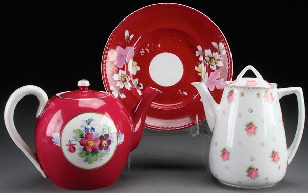 A GROUP OF RUSSIAN PORCELAIN: A GROUP OF RUSSIAN PORCELAIN. Comprising an early Soviet period teapot, a Kuznetsov marked plate, and a Gardner teapot with floral decorations. Greatest size 8.5 inches (21.5 cm).