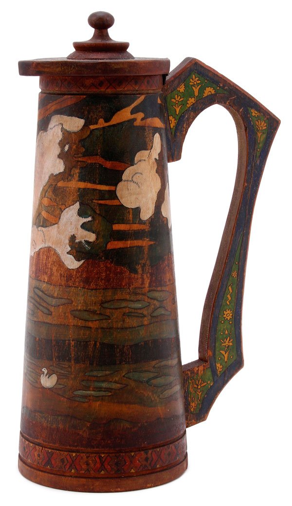 A RUSSIAN PAINTED WOOD TANKARD, SERGIEV POSAD: A FINE RUSSIAN KUSTAR POLYCHROME CARVED WOOD TANKARD, SERGIEV POSAD, CIRCA 1910. Of tapering cylindrical form with attached scroll handle and hinged lid. The sides painted with a scene from a Russian