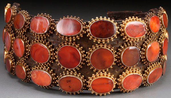 A MONTENEGRO CARNELIAN MOUNTED LEATHER JAKICAR 18TH C: A MONTENEGRO CARNELIAN MOUNTED LEATHER JAKICAR (BELT), SERBIA, 18TH/19TH CENTURY. Comprising three layers of stitched hide mounted with three rows of carnelian polished cabochons each contained in a s