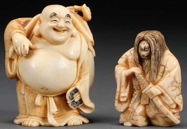 A PAIR OF JAPANESE CARVED IVORY OKIMONOS, MEIJI/TAISHO: A PAIR OF JAPANESE CARVED IVORY OKIMONOS, MEIJI/TAISHO PERIOD. Of a Hotei with sack and a samurai netsuke with rotating face. Largest height 2.75 inches (7 cm).