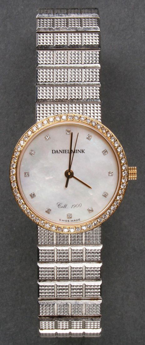 MINK COLLECTION 1900 LADIES GOLD AND DIAMOND WATCH: A DANIEL MINK COLLECTION 1900 LADIES GOLD AND DIAMOND WRIST WATCH, LATE 20TH CENTURY. The stainless steel watch with 18k gold and diamond bezel surrounding a mother of pearl face. Diameter 1 inch (2.5