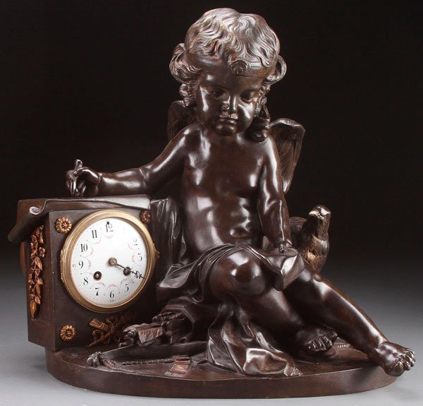 FRENCH BRONZE FIGURAL CLOCK, AFTER CLODION: AFTER CLAUDE MICHEL CLODION (FRENCH 1738-1814). A bronze figural clock of cupid with dove. Inscribed on verso Clodion. Height 16.5 inches (42 cm).