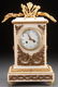 A FRENCH LOUIS XVI STYLE GILT BRONZE MANTLE CLOCK