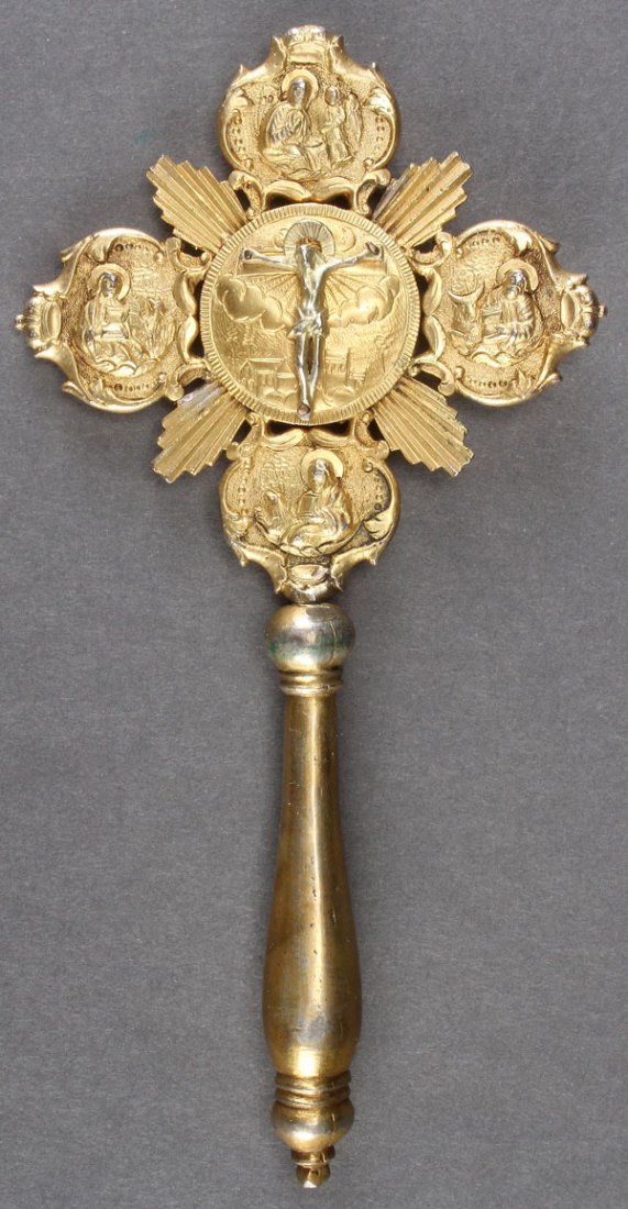 A GREEK OR ARMENIAN ORTHODOX GILDED BLESSING CROS: A GREEK OR ARMENIAN ORTHODOX GILDED BLESSING CROSS, 19TH CENTURY. The solid spindle handle holding a quatrefoil fan with central sunburst medallion depicting on one side the crucified Christ against t