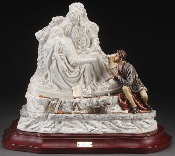 A LARGE AND IMPRESSIVE CAPODIMONTE PORCELAIN GROU: A LARGE AND IMPRESSIVE CAPODIMONTE PORCELAIN GROUP OF MICHELANGELO CARVING THE PIETA, 2ND HALF 20TH CENTURY. Sculpted in full round and artist signed on base Cortese, and numbered 294/990. Height 14 i