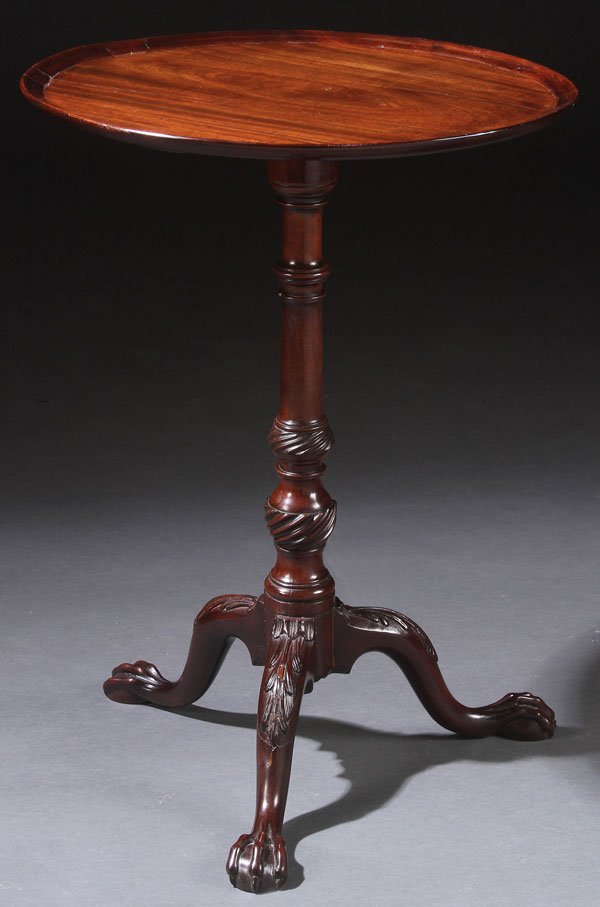 18TH C CHIPPENDALE CARVED ENGLISH MAHOGANY CANDLE STAND: A FINE CHIPPENDALE CARVED ENGLISH MAHOGANY CANDLE STAND, CIRCA 1760-70. With circular top raised on a carved tripod stand with claw feet. Height 23 inches (59.4 cm), diameter 17 inches (43 cm).