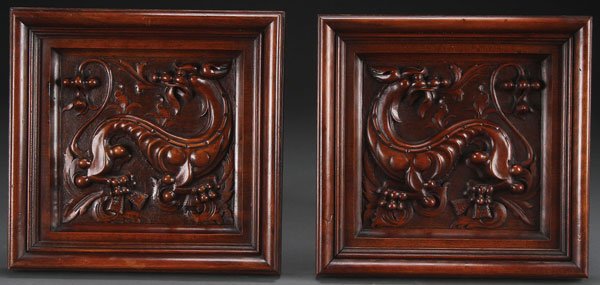 PAIR NORTHERN ITALIAN CARVED WALNUT FIGURAL PANELS: A PAIR OF NORTHERN ITALIAN CARVED WALNUT FIGURAL PANELS, LATE 19TH CENTURY. Each depicting Renaissance style lions in deep relief within raised self framing borders. 12 inches (30 cm) square.