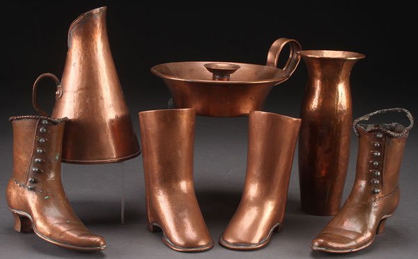 7 PIECE 19TH CENTURY COPPERWARE COOKWARE GROUP: A 19TH CENTURY COPPERWARE GROUP, SEVEN PIECES. Comprising a handled measure, chamber stick, hand hammered vase, and four boot shape match holders. Largest height 8 inches (20 cm).
